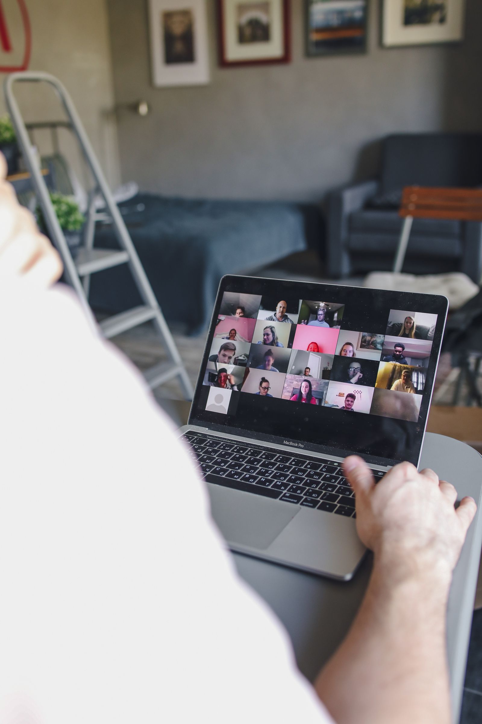 Someone on a video call with a remote team on their laptop
